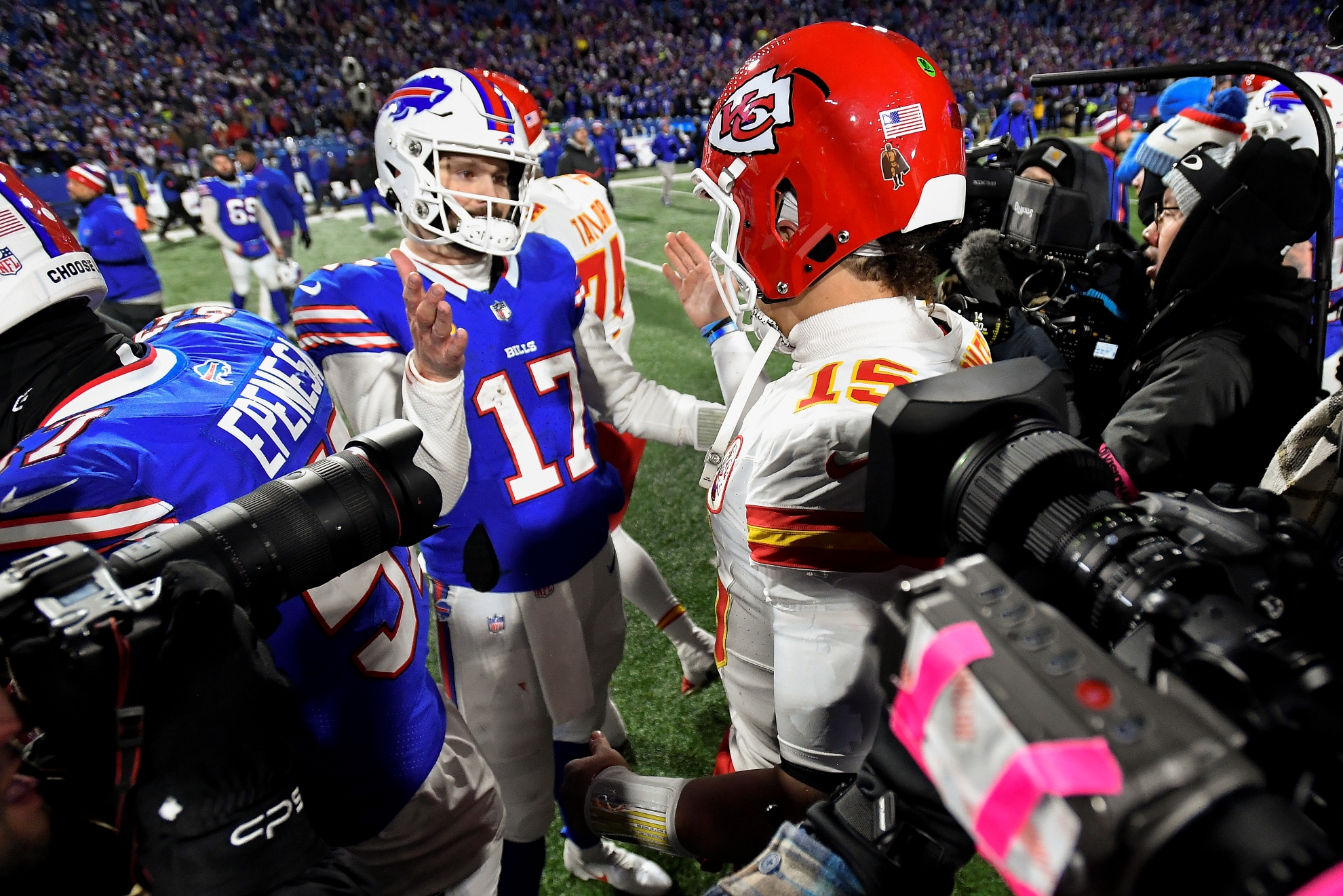 Buffalo Bills quarterback Josh Allen (17) greets Kansas City Chiefs quarterback Patrick Mahomes (15)