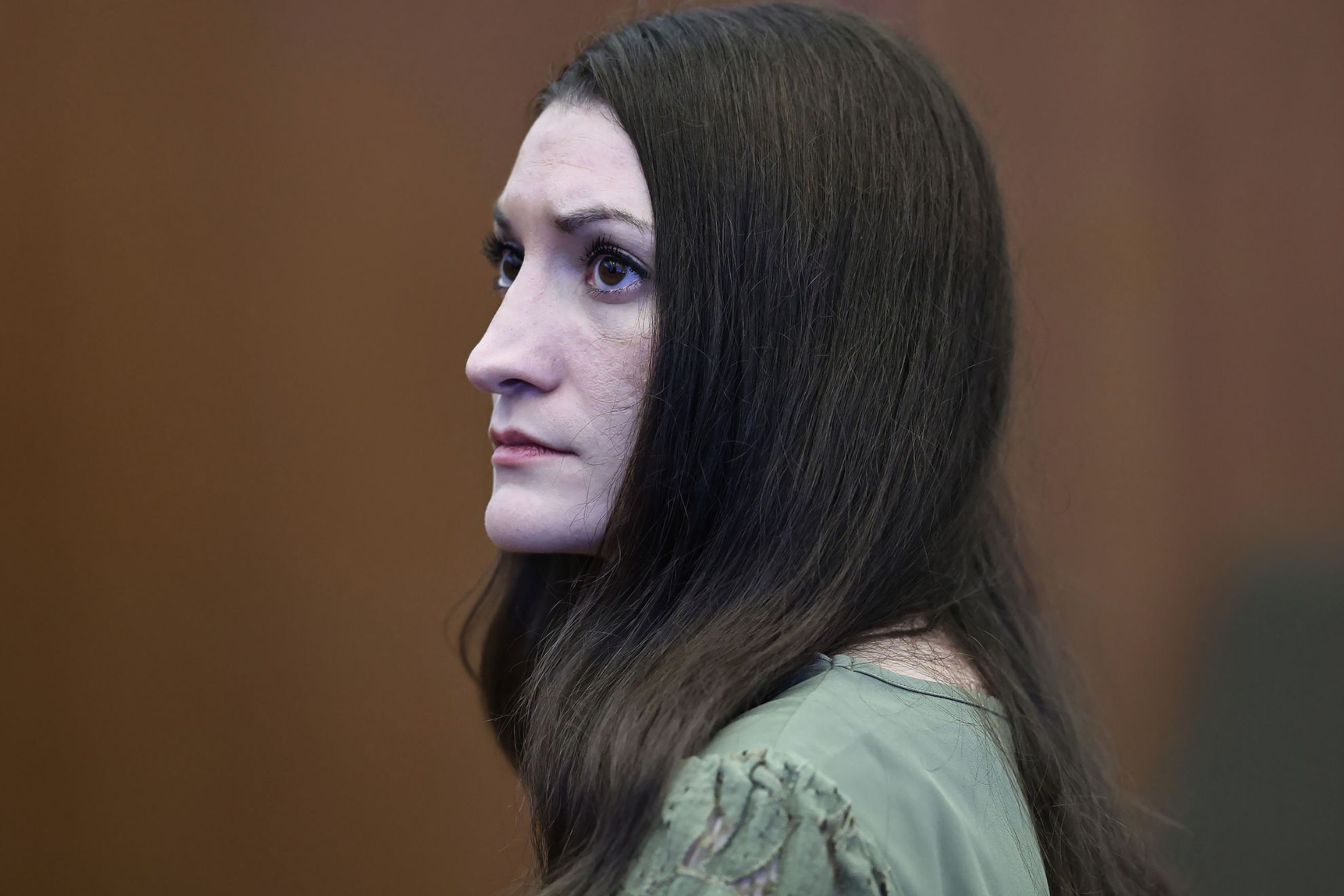 Defendant Lindsay Clancy looks at the jury