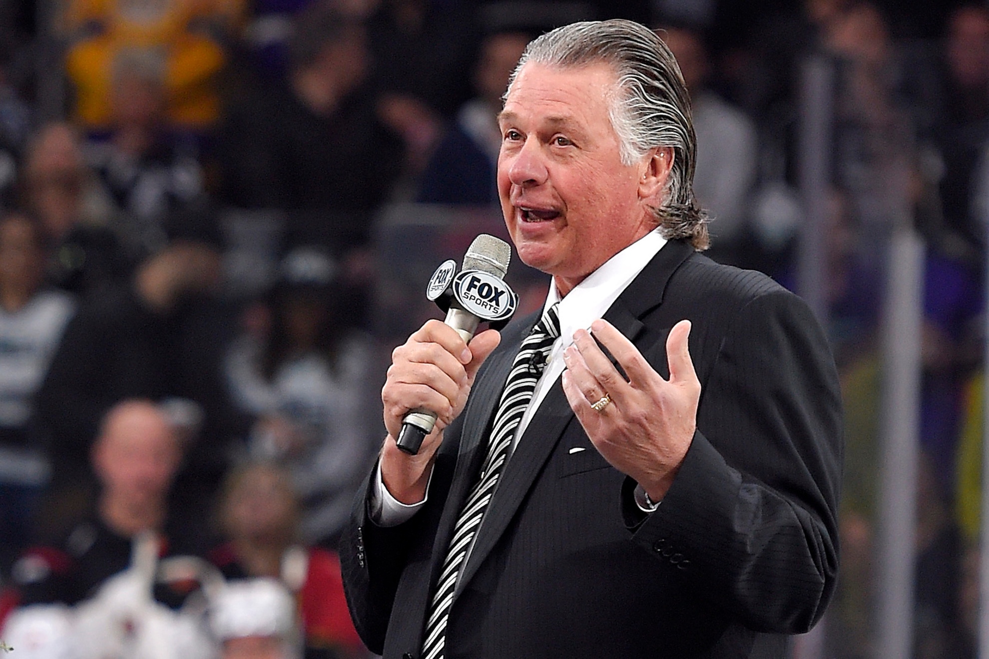 FILE - Former Los Angeles Kings coach Barry Melrose speaks to fans Mark J. Terrill