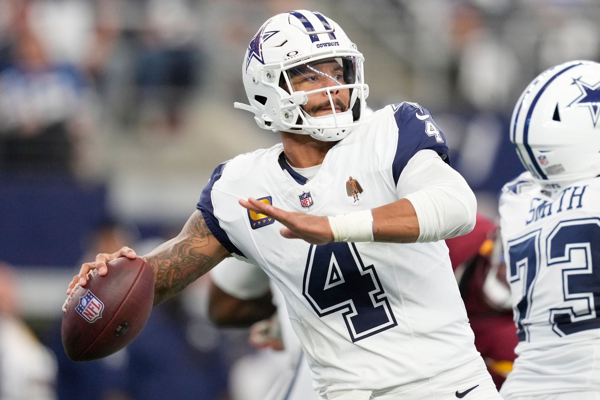 Dallas Cowboys quarterback Dak Prescott throws a pass against the Washington Commanders