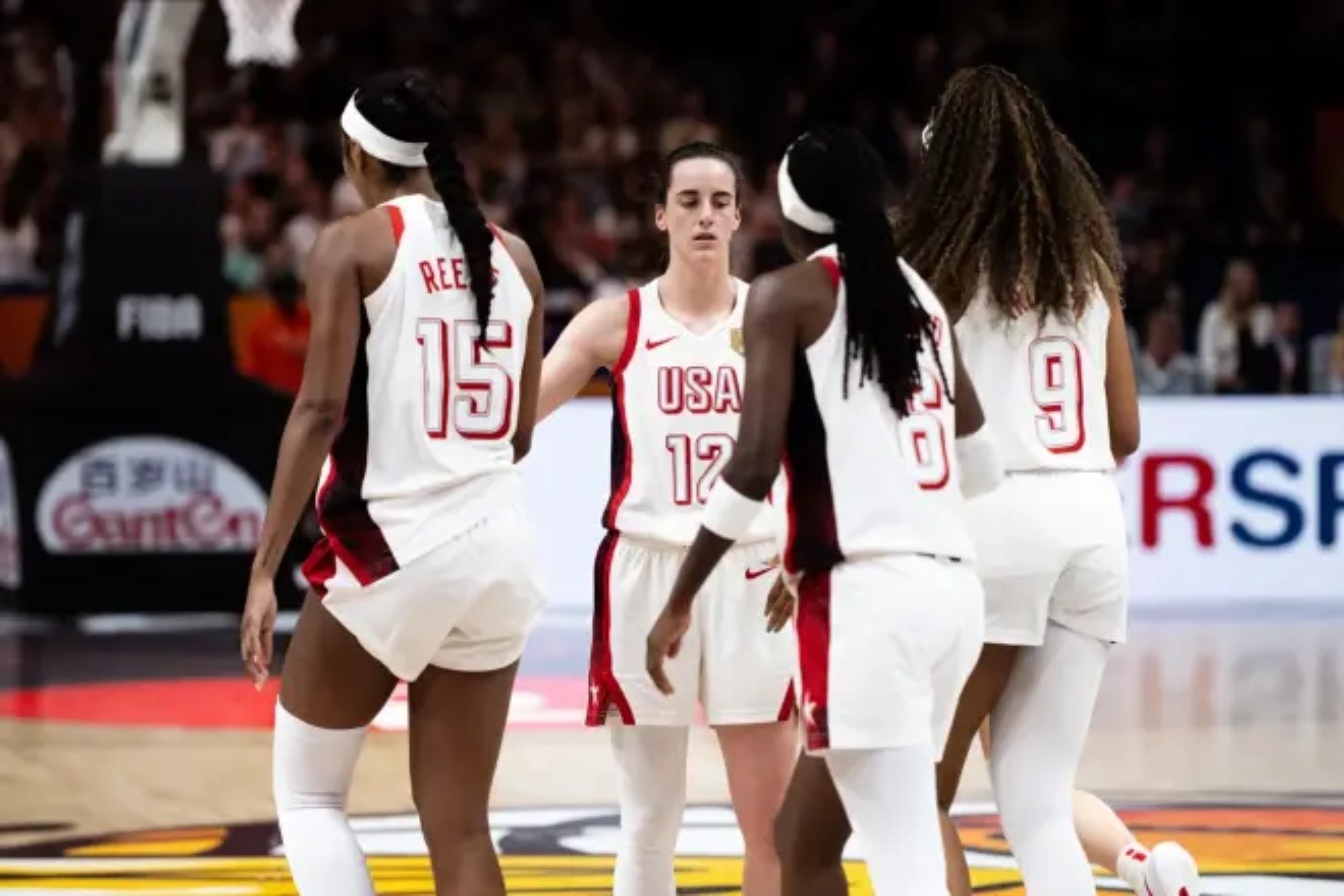 Caitlin Clark with Angel Reese, Rhyne Howard, and Kiki Iriafen FIBA PHOTO /