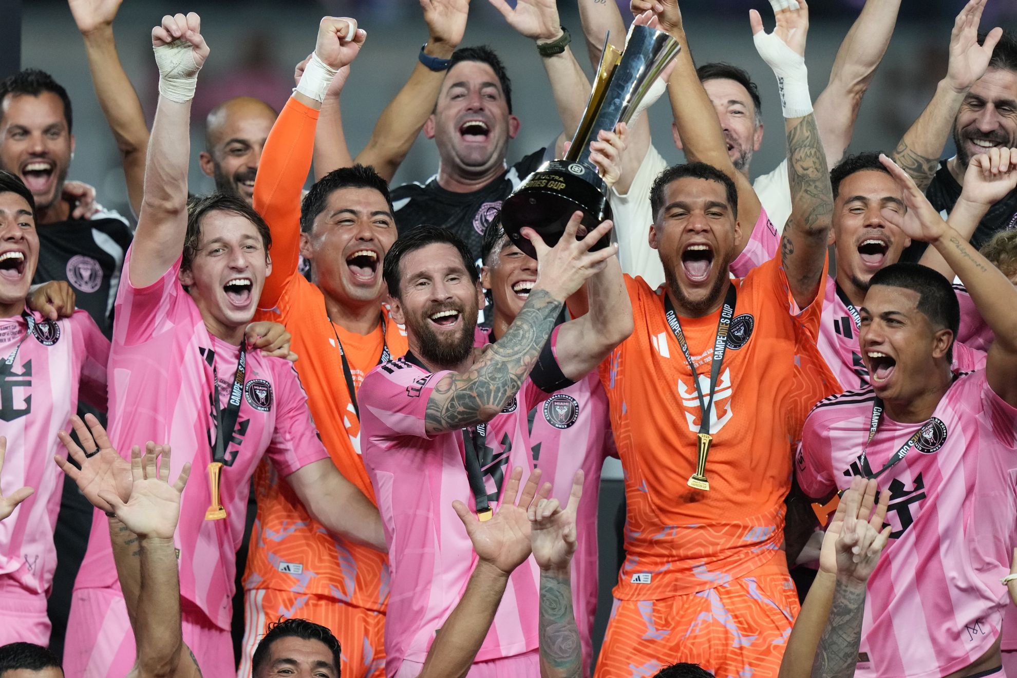 Inter Miami's Lionel Messi celebrates with teammates after defeating Cruz Azul in the Campeones Cup.