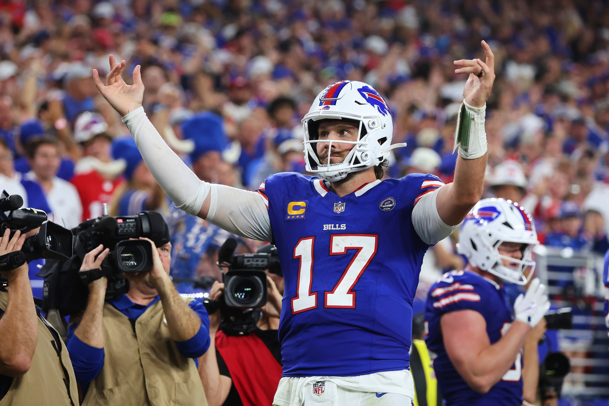 Buffalo Bills quarterback Josh Allen (17) celebrates his rushing touchdown against the Detroit Lions