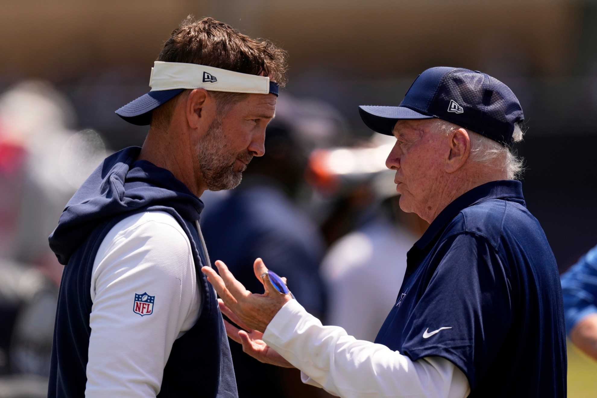 Dallas Cowboys head coach Brian Schottenheimer, left, talks with Cowboys owner, president and general manager Jerry Jones