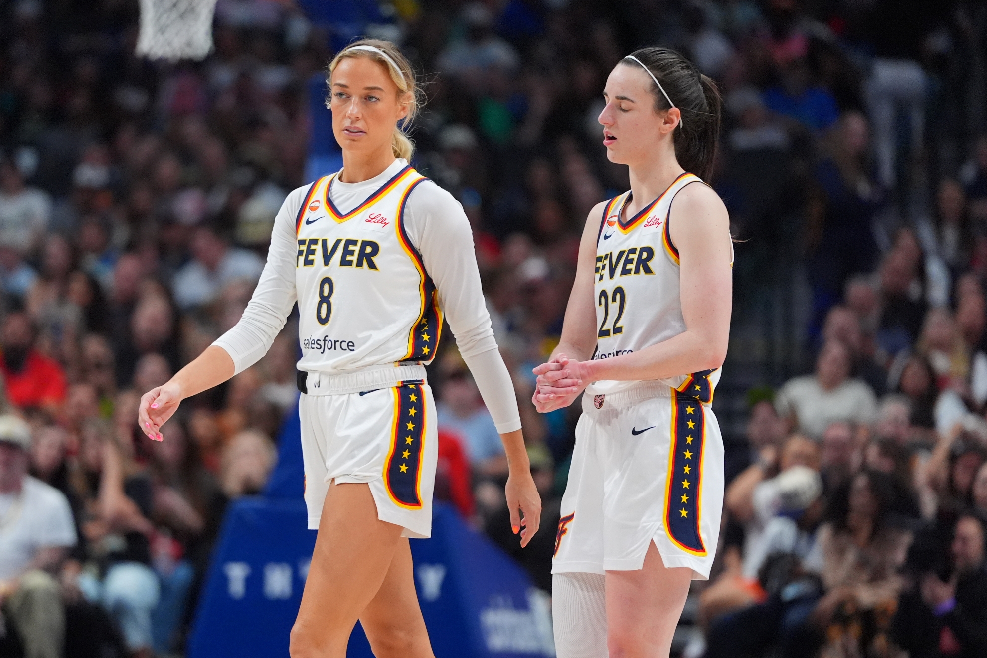 Indiana Fever guard Caitlin Clark (22) reacts to a play with teammate guard Sophie Cunningham (8)
