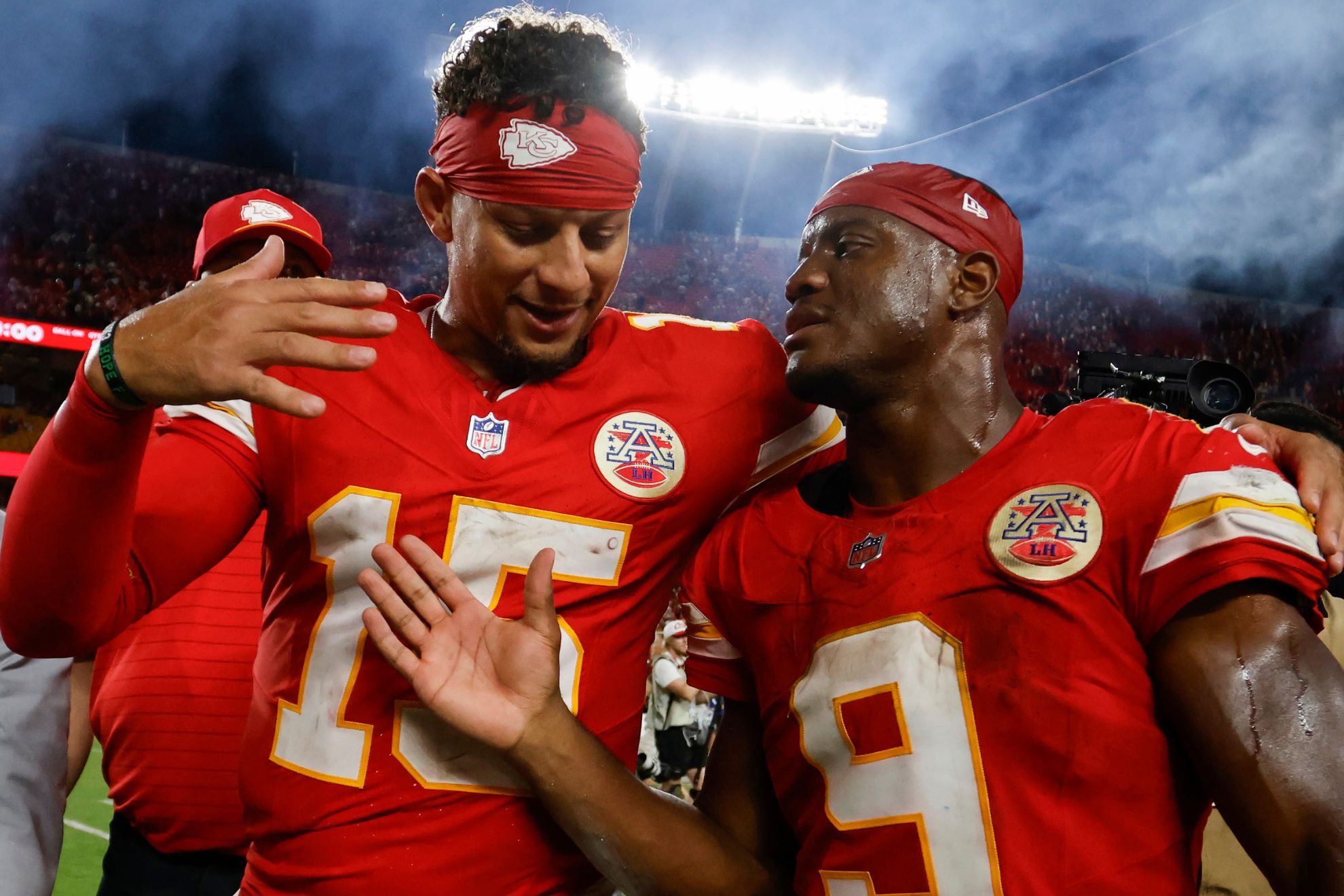 Kansas City Chiefs quarterback Patrick Mahomes (15) and running back Kenneth Walker III (9)