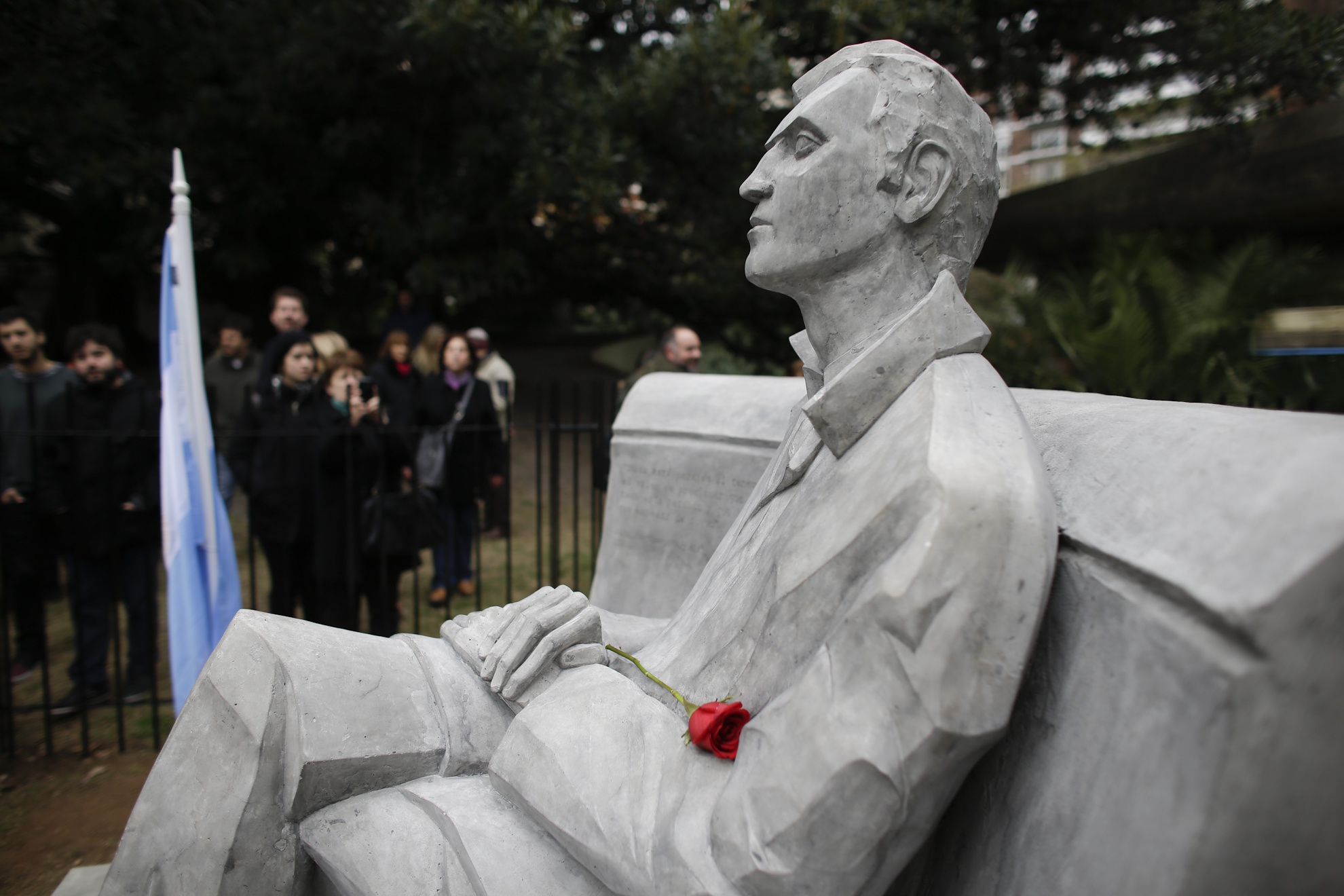 A rose lays on a statue of writer Julio Cortazar after it was unveiled on the 100 year anniversary of his birth in Buenos Aires, Argentina. LAPRESSE