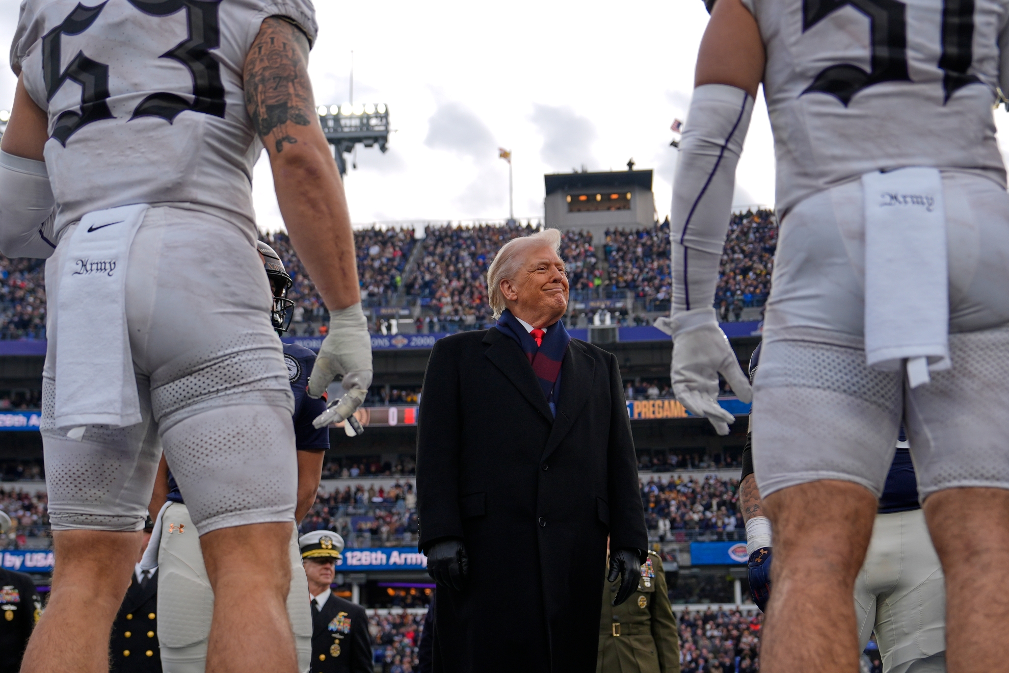 President Donald Trump takes part in the coin toss before the start of the 126th Army-Navy NCAA college football game