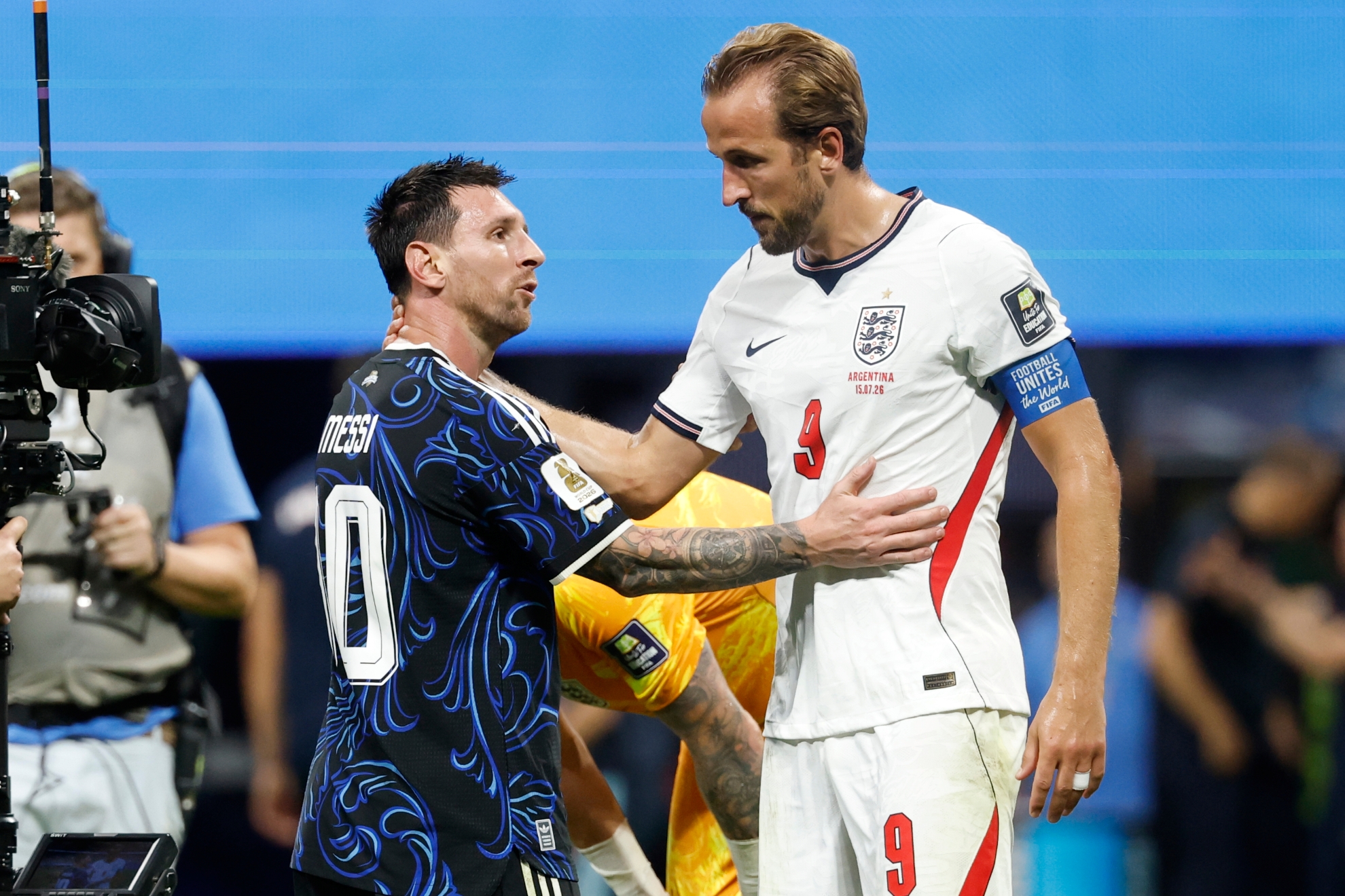 Argentina's Lionel Messi (10) and England's Harry Kane (9) hug after the World Cup semifinal soccer match between England and Argentina