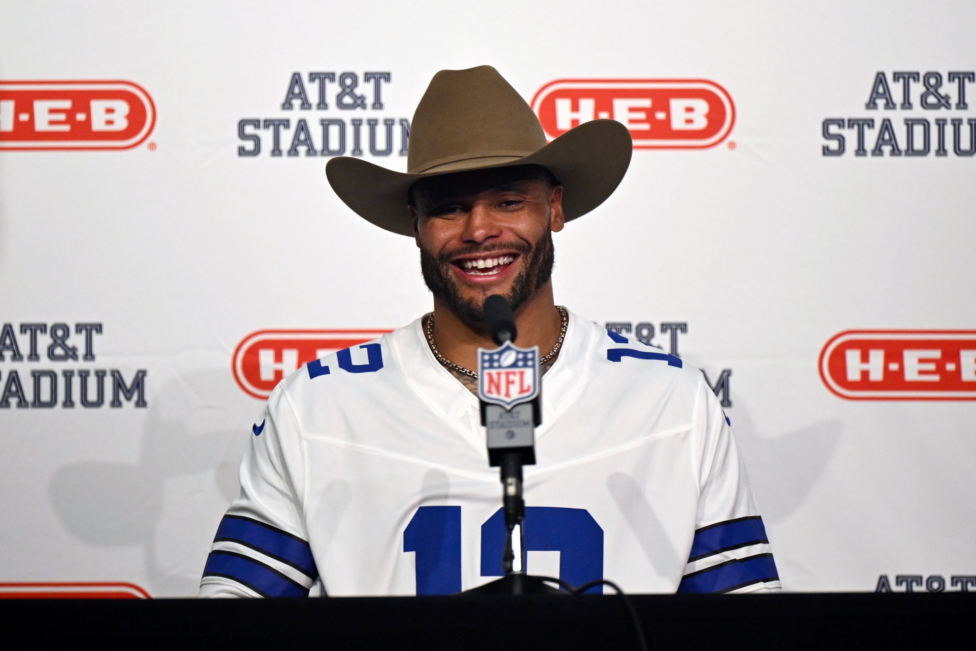 Dallas Cowboys quarterback Dak Prescott speaks in a press conference after an NFL football game against the Washington Commanders