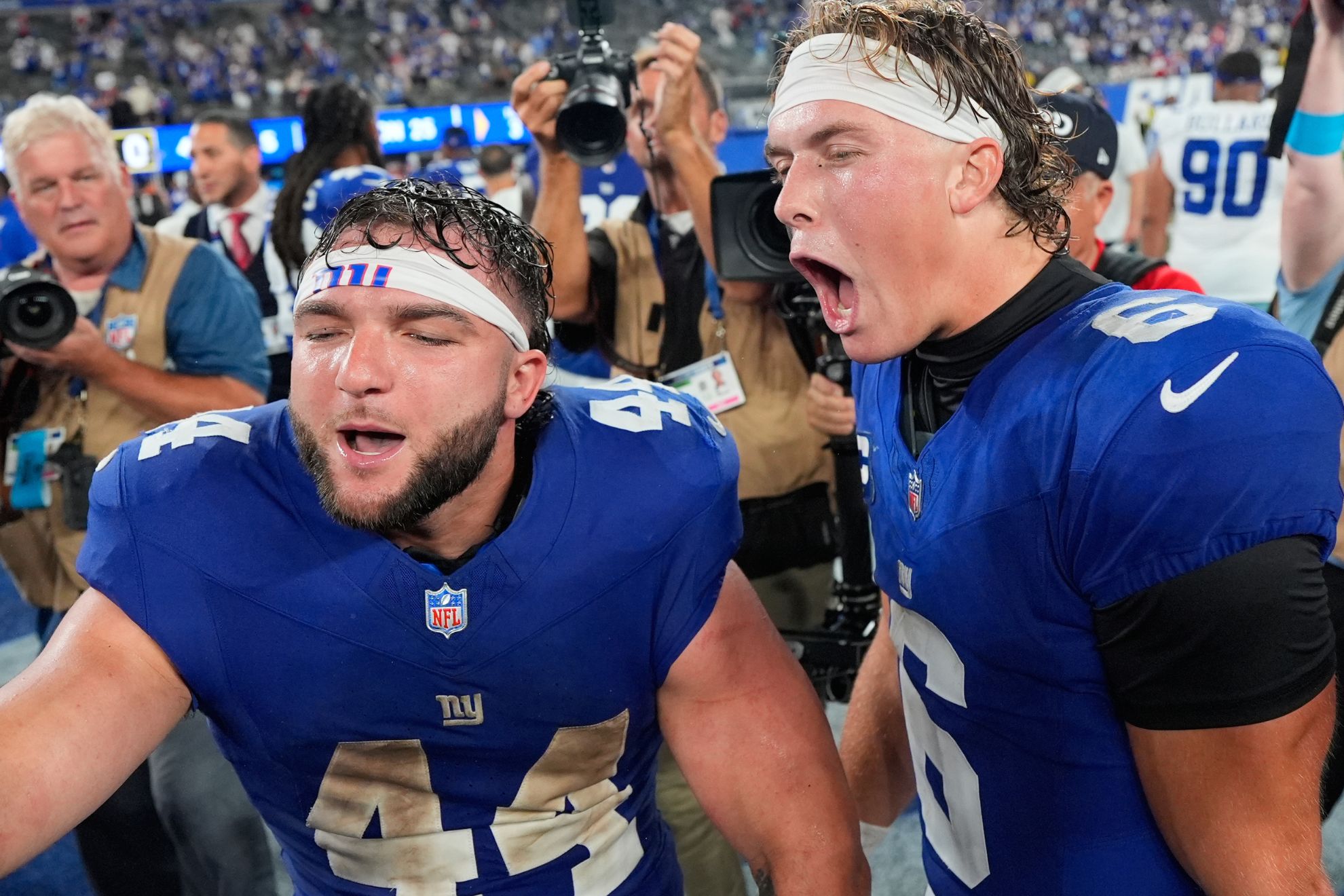 New York Giants running back Cam Skattebo (44) and quarterback Jaxson Dart (6)