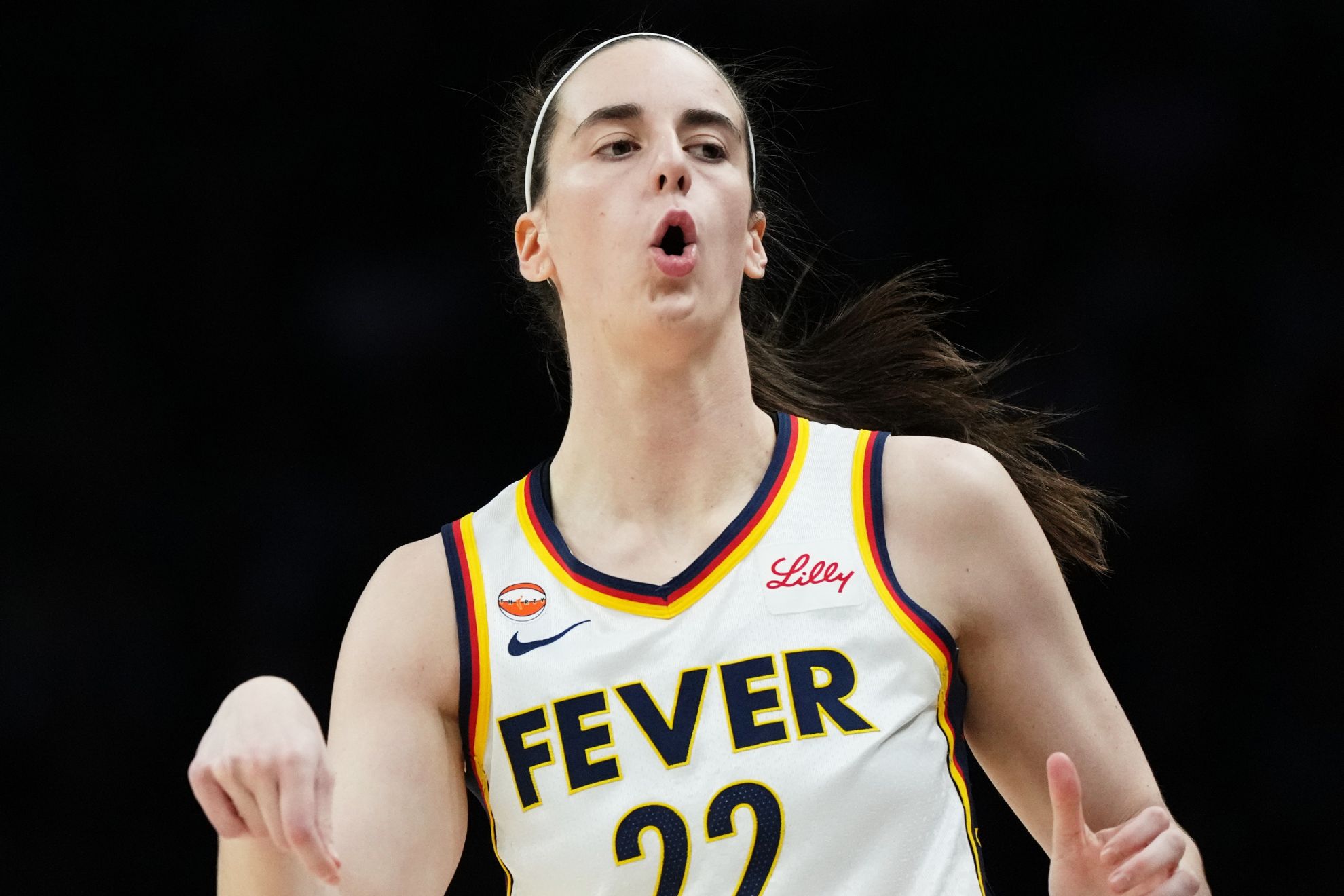 Indiana Fever guard Caitlin Clark reacts during the first half of a WNBA basketball game against the Minnesota Lynx