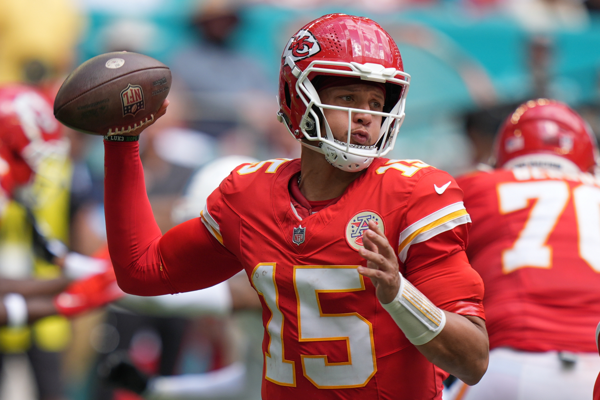 Kansas City Chiefs quarterback Patrick Mahomes looks to pass during an NFL football game against the Miami Dolphins