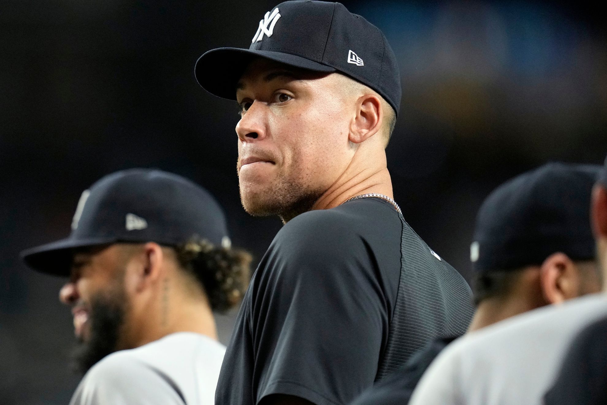 Injured New York Yankees' Aaron Judge pauses on the field after a baseball game against the Arizona Diamondbacks