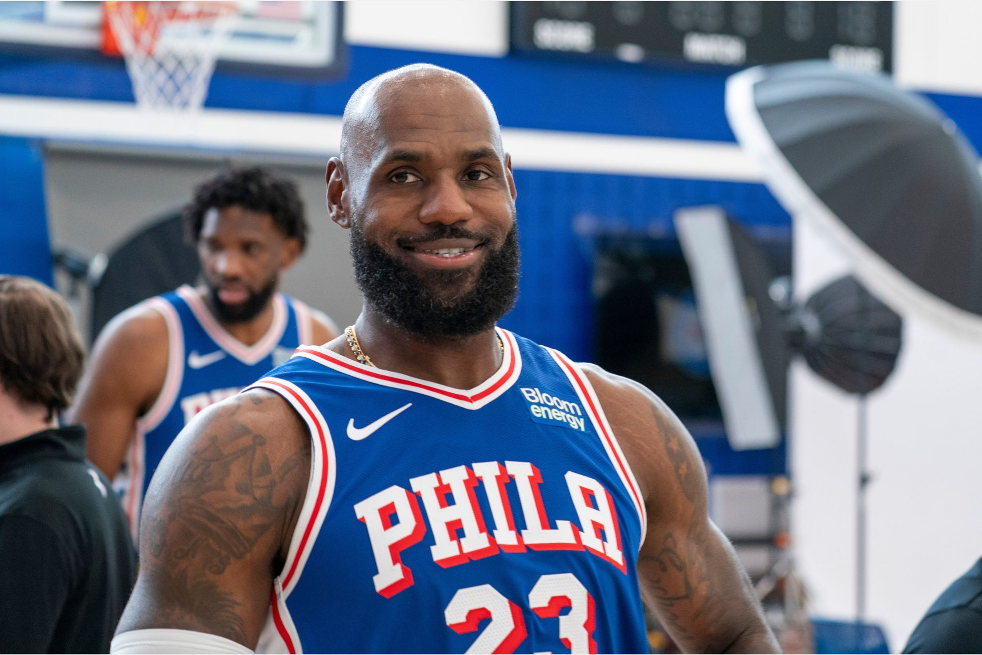 Philadelphia 76ers' LeBron James reacts as he goes between stations during the NBA basketball team's media day