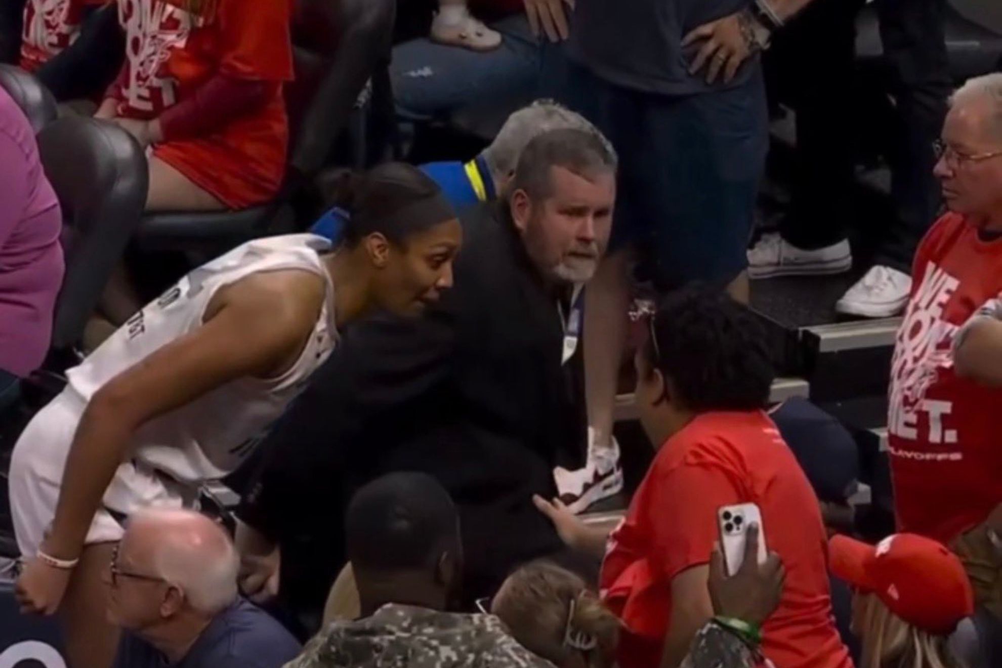 Las Vegas Aces star A’ja Wilson approaches the stands to confront an Indiana Fever fan