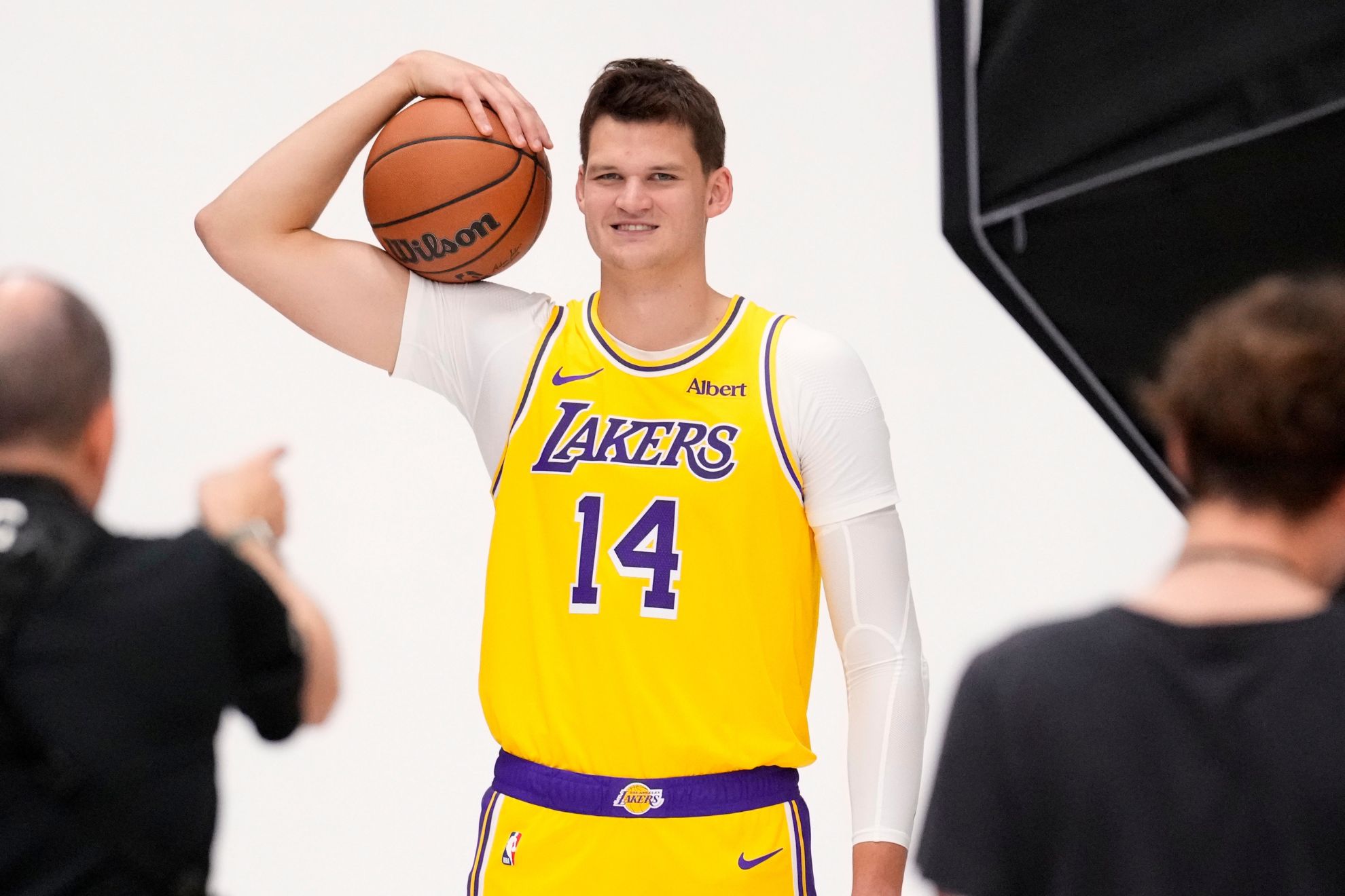 Los Angeles Lakers' Walker Kessler poses for pictures