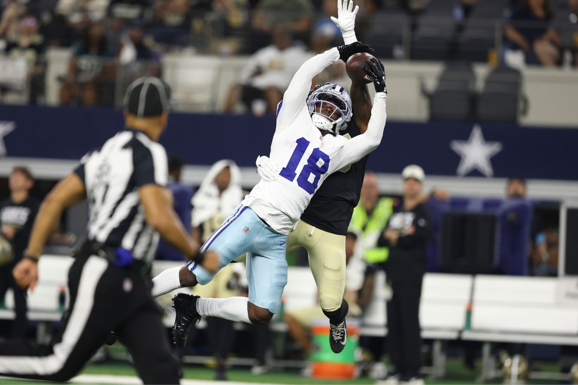 Dallas Cowboys wide receiver Jordan Hudson (18) makes a catch in front of New New Orleans Saints cornerback David Long Jr. (45)