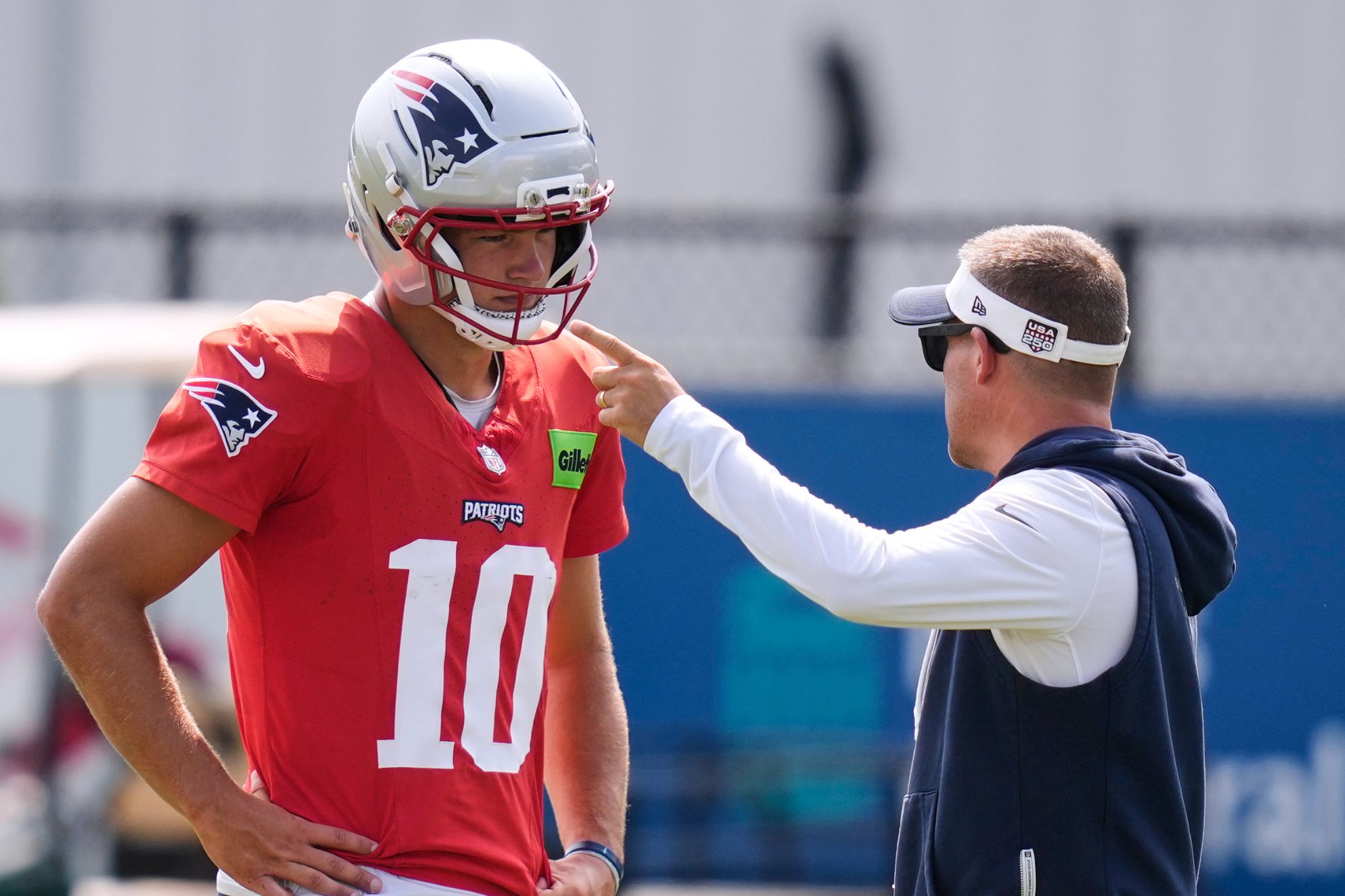 New England Patriots quarterback Drake Maye (10) listens to offensive coordinator Josh McDaniels