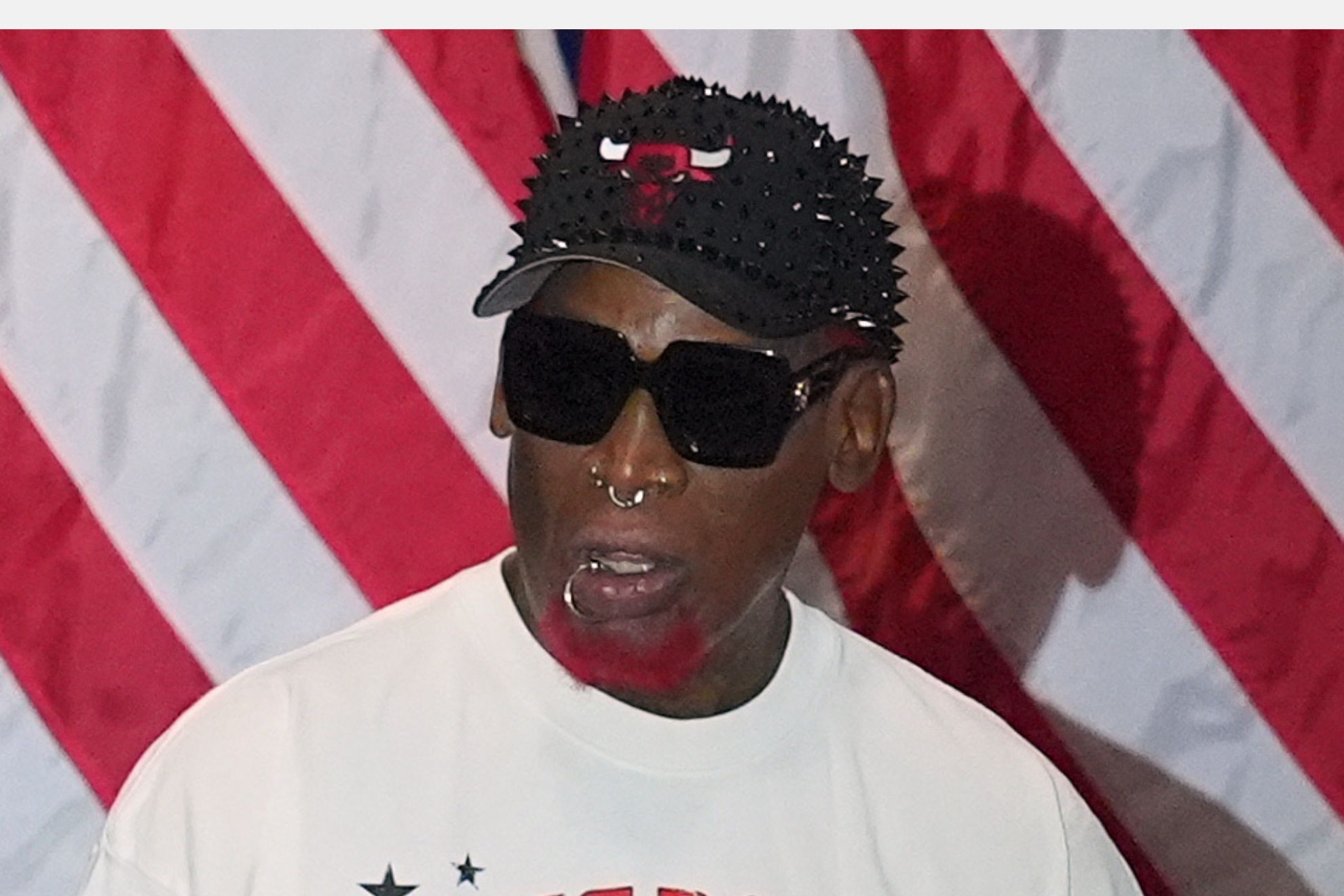 Dennis Rodman listens a President Donald Trump speaks at a campaign rally at the Choctaw Event Center