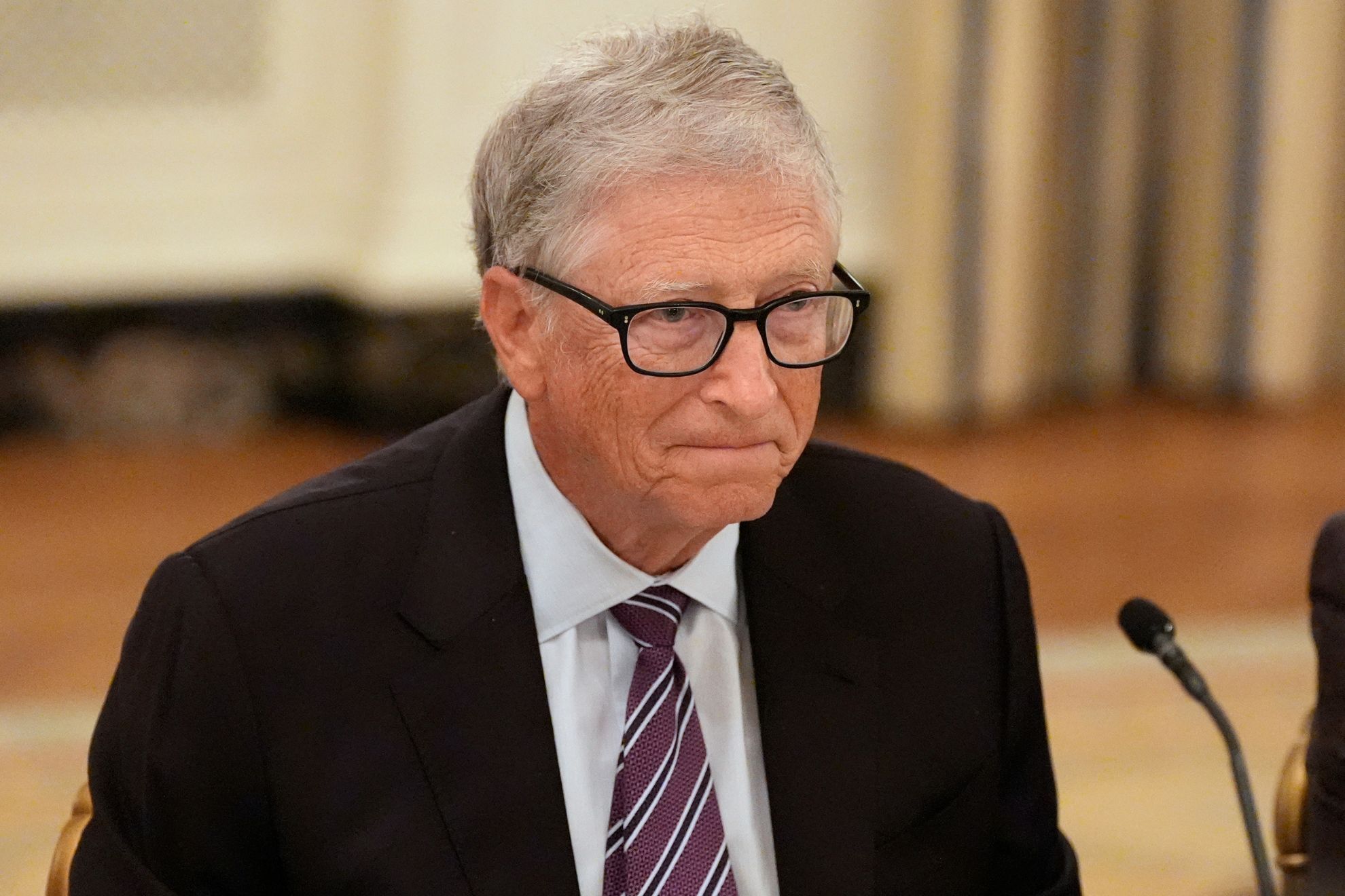 Bill Gates attends a dinner with President Donald Trump in the State Dining Room of the White House