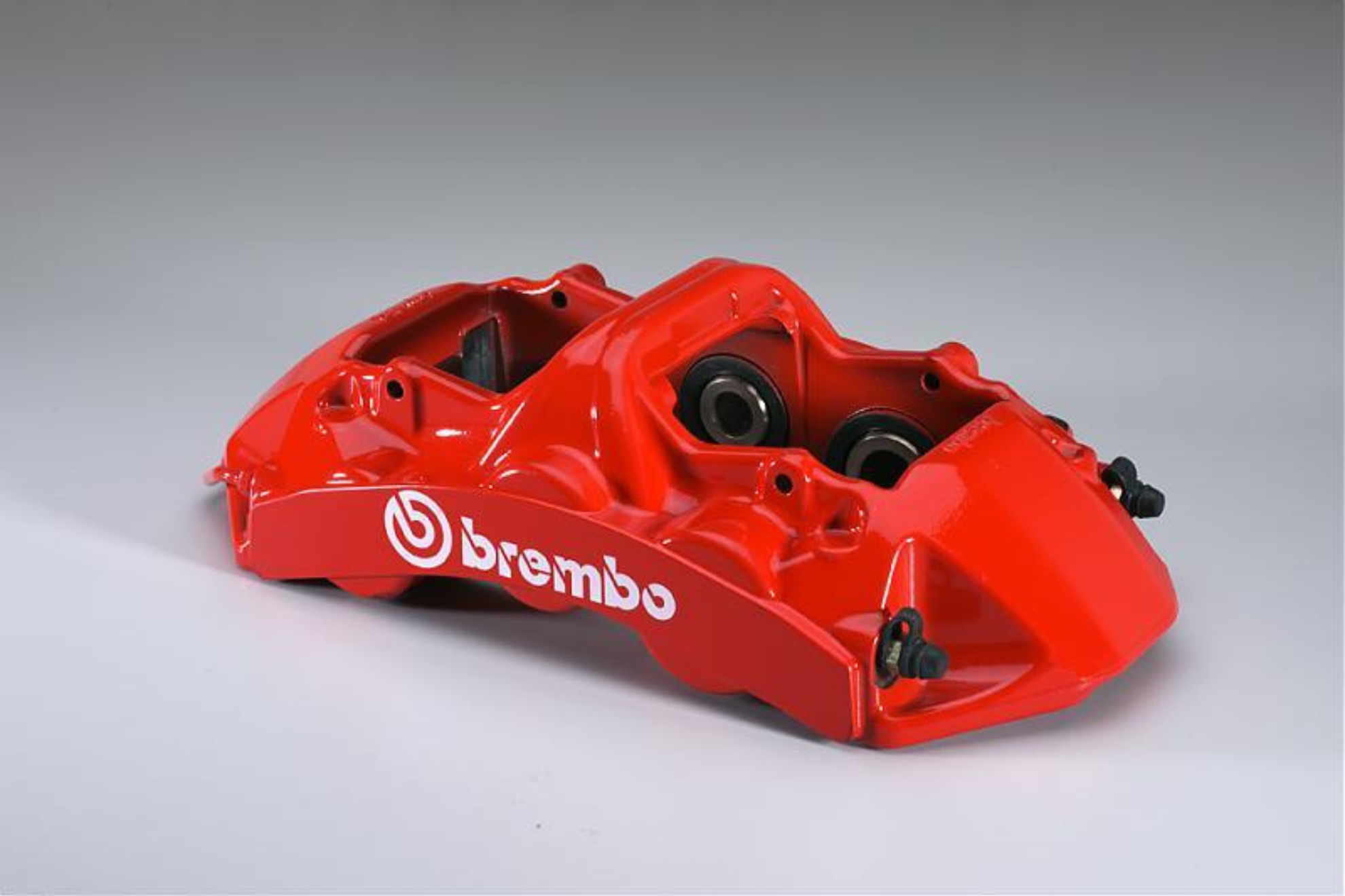 Brembo developed its first monoblock brake caliper in 1987 before the technology moved from motorsport into production cars.