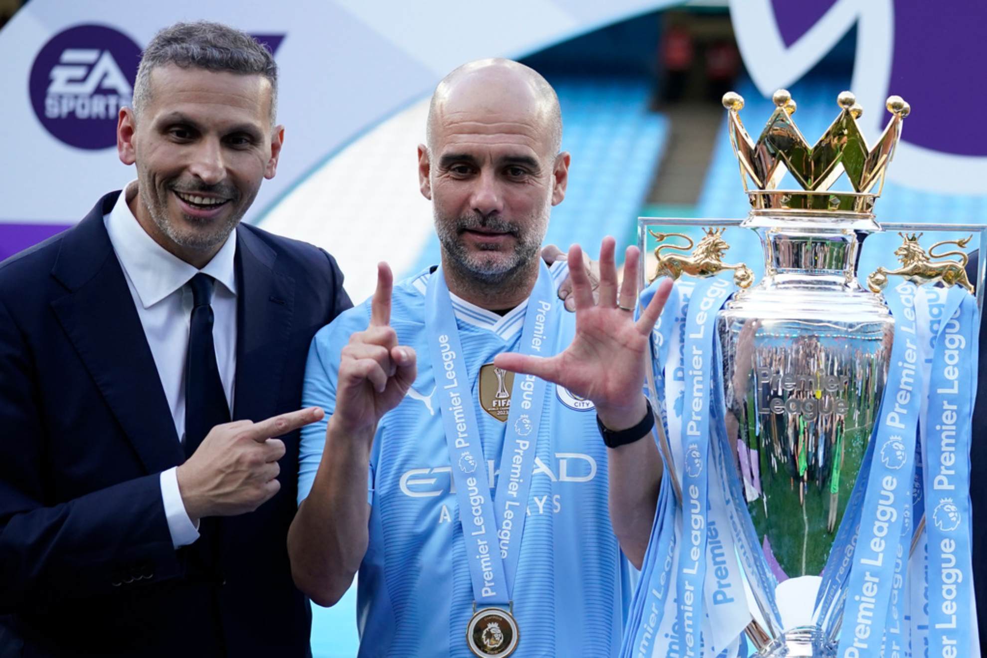Manchester City's head coach Pep Guardiola and chairman Khaldoon Al Mubarak celebrate with the Premier League trophy Dave Thompson