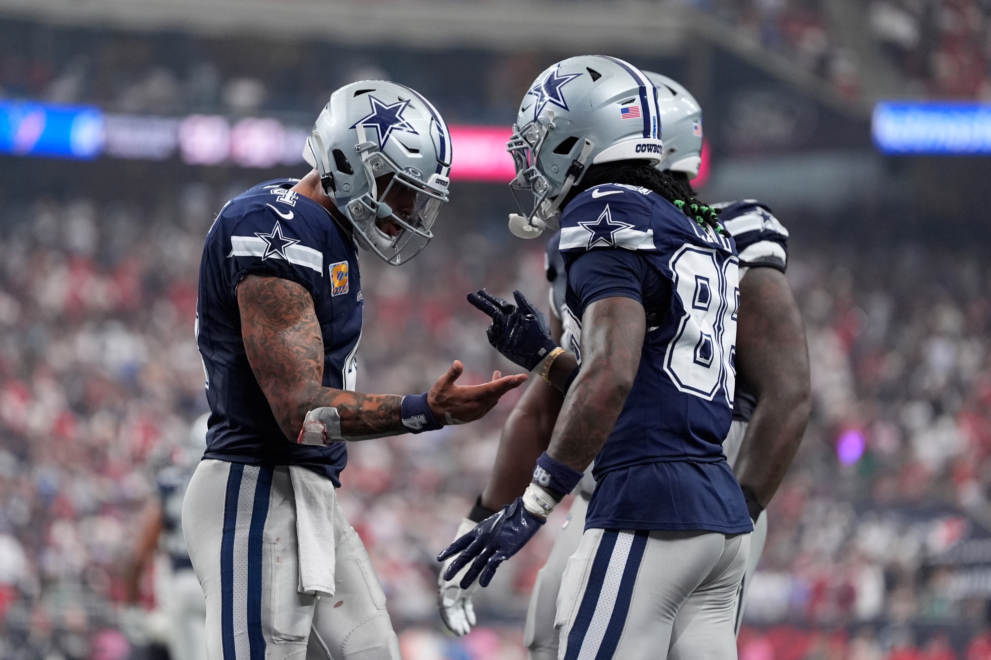 Dallas Cowboys wide receiver Ceedee Lamb, right, celebrates his touchdown with quarterback Dak Prescott