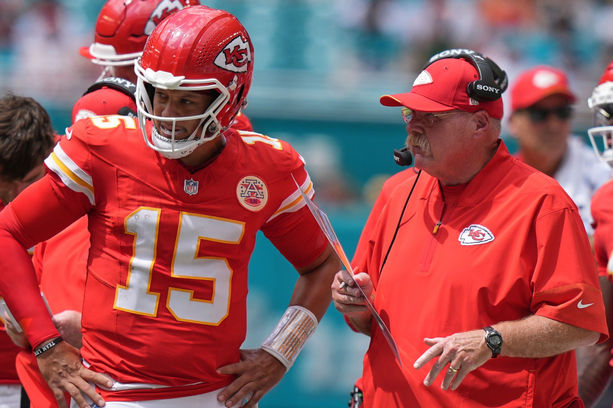 Kansas City Chiefs quarterback Patrick Mahomes (15) talks with Kansas City Chiefs head coach Andy Reid during an NFL football game against the Miami Dolphins, Sunday, Sept. 27, 2026, in Miami Gardens. Lynne Sladky