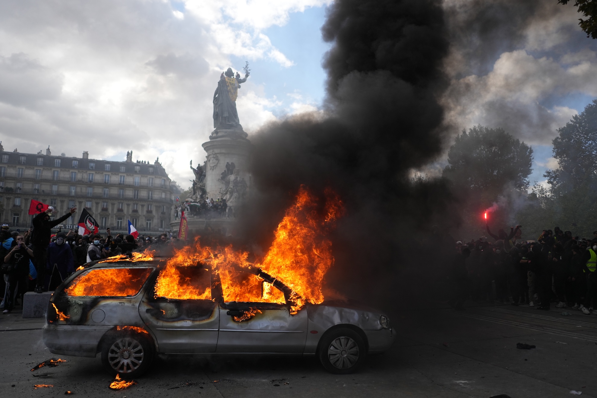 A car burns at Republique square during a protest against rising living costs, joining students' grievances LAPRESSE