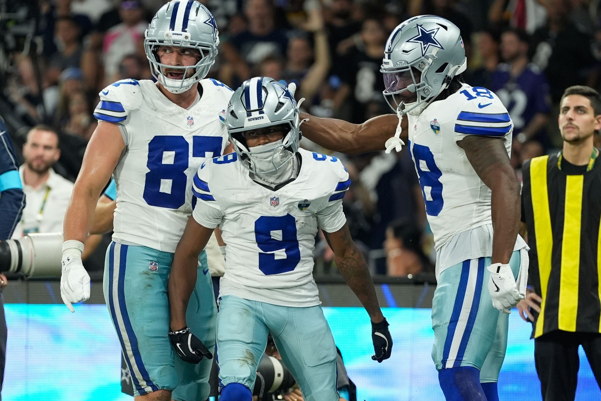 Dallas Cowboys wide receiver Kavontae Turpin (9) celebrates with tight end Jake Ferguson (87) and wide receiver Jonathan Mingo (18)