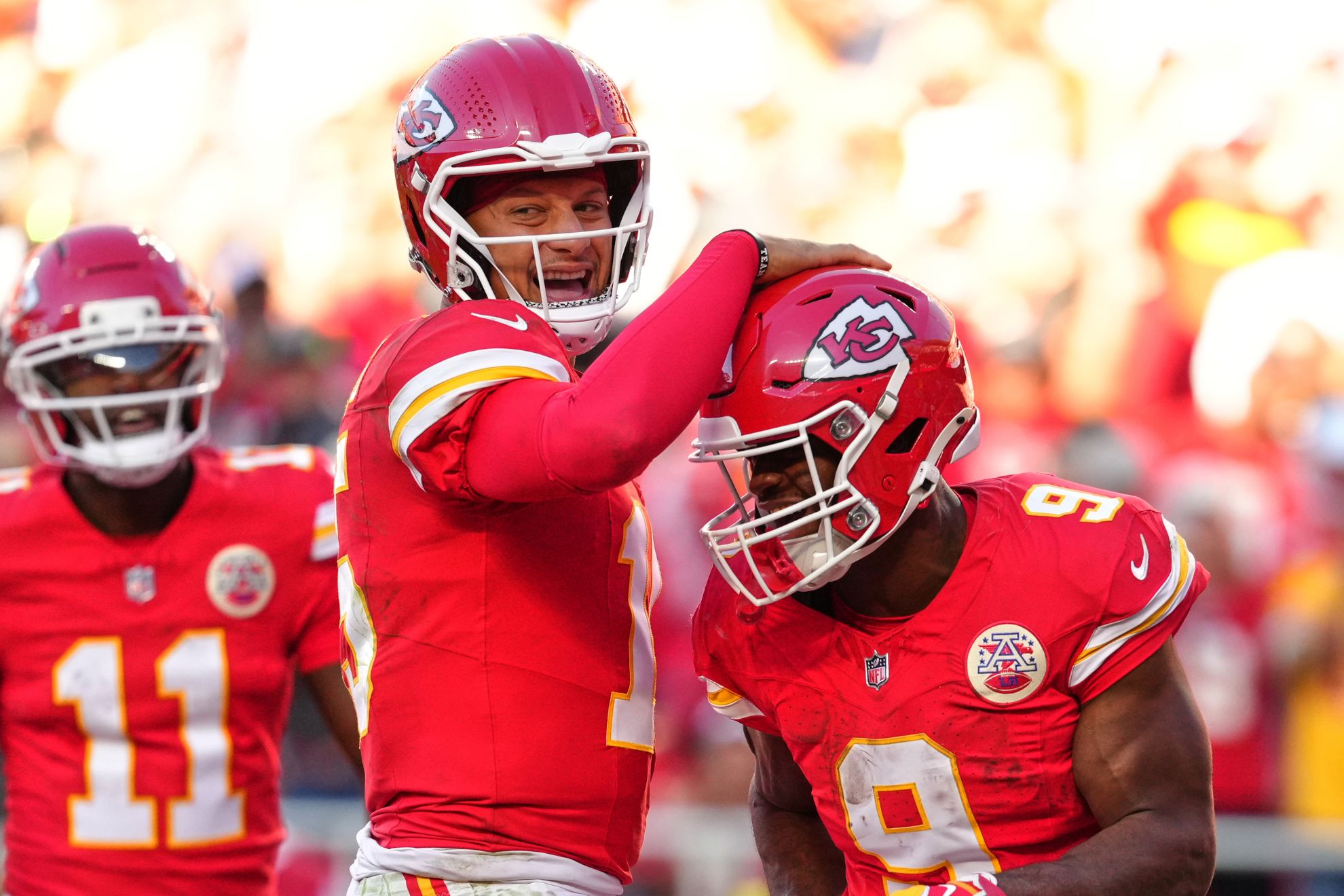 Kansas City Chiefs quarterback Patrick Mahomes, center left, and Kenneth Walker III (9)
