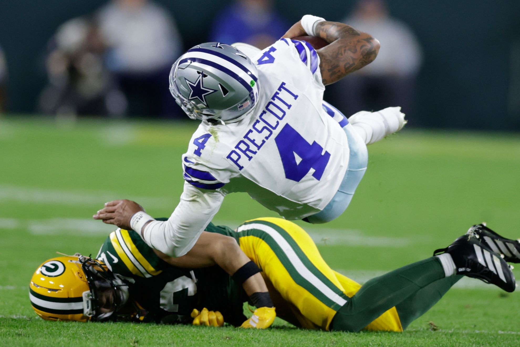 Green Bay Packers' Evan Williams stops Dallas Cowboys' Dak Prescott