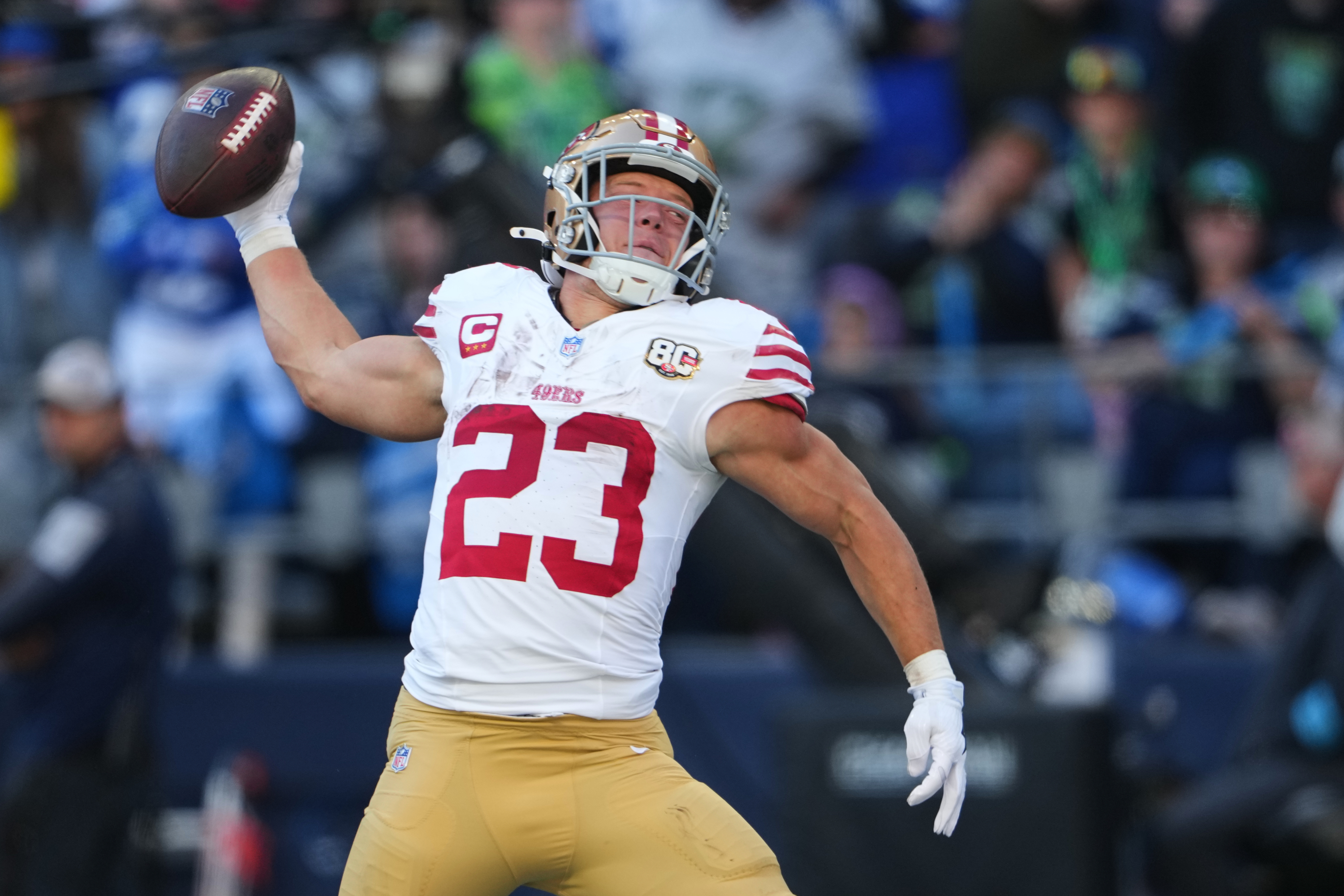 San Francisco 49ers running back Christian McCaffrey (23) spikes the ball after scoring on a touchdown run against the Seattle Seahawks during the first half of an NFL football game Sunday, Oct. 11, 2026, in Seattle. (AP Photo/Lindsey Wasson) Lindsey Wasson