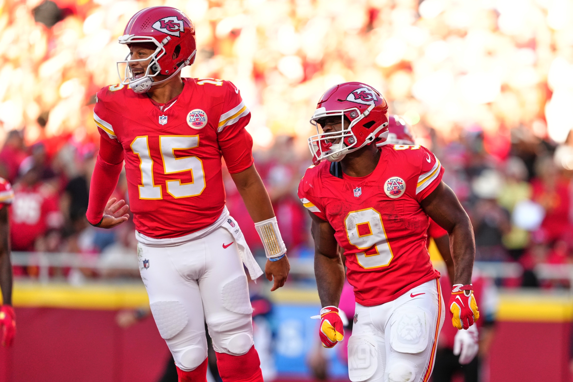 Kansas City Chiefs quarterback Patrick Mahomes (15) and Kenneth Walker III (9) celebrate a touchdown against the Los Angeles Chargers