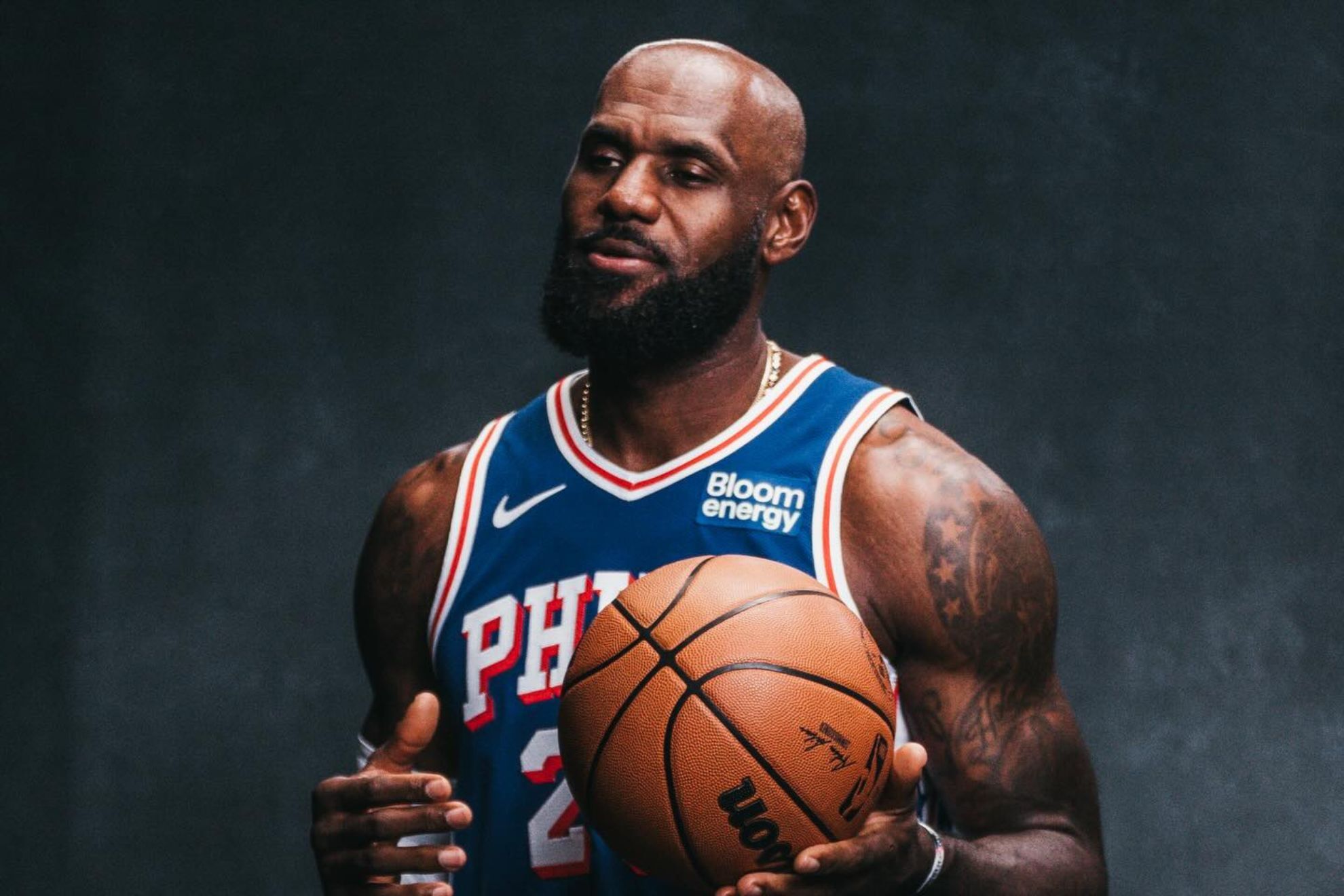 LeBron James shows off the patch marking his historic 24th NBA season