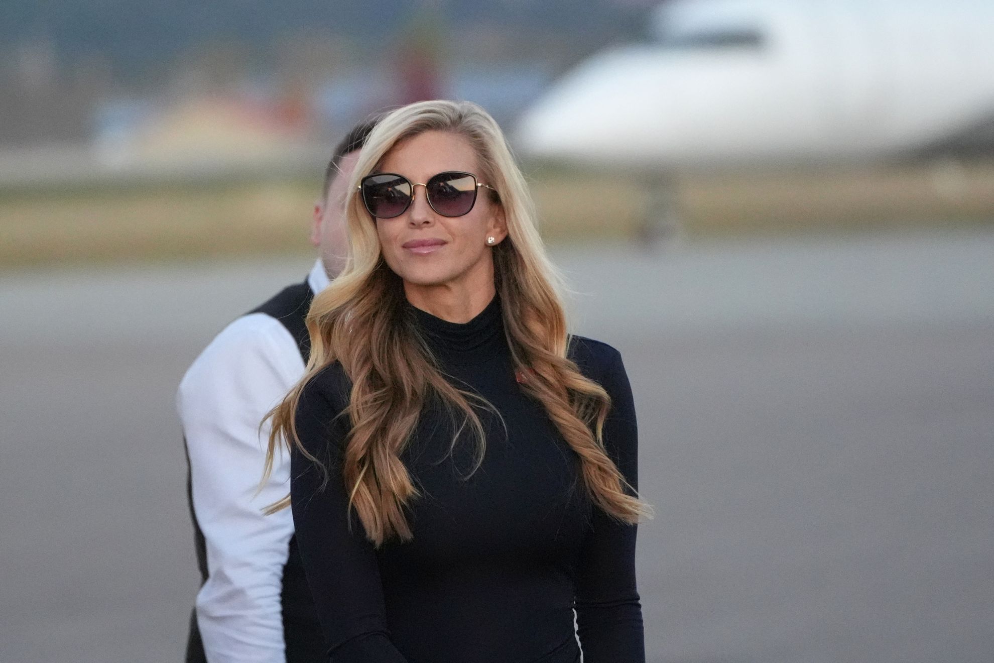 White House press secretary Katie Zacharia arrives with President Donald Trump at Glacier Park International Airport