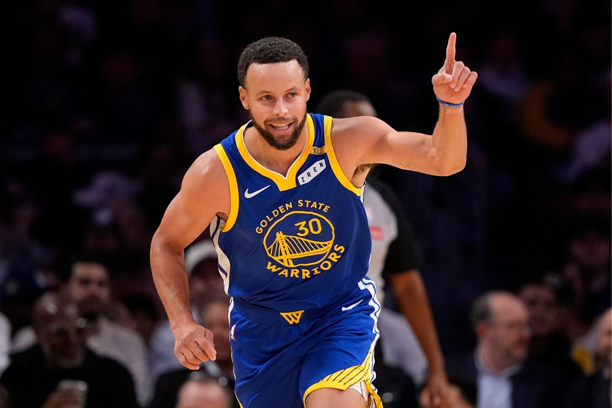 Golden State Warriors guard Stephen Curry gestures after scoring during the first half of an NBA basketball game