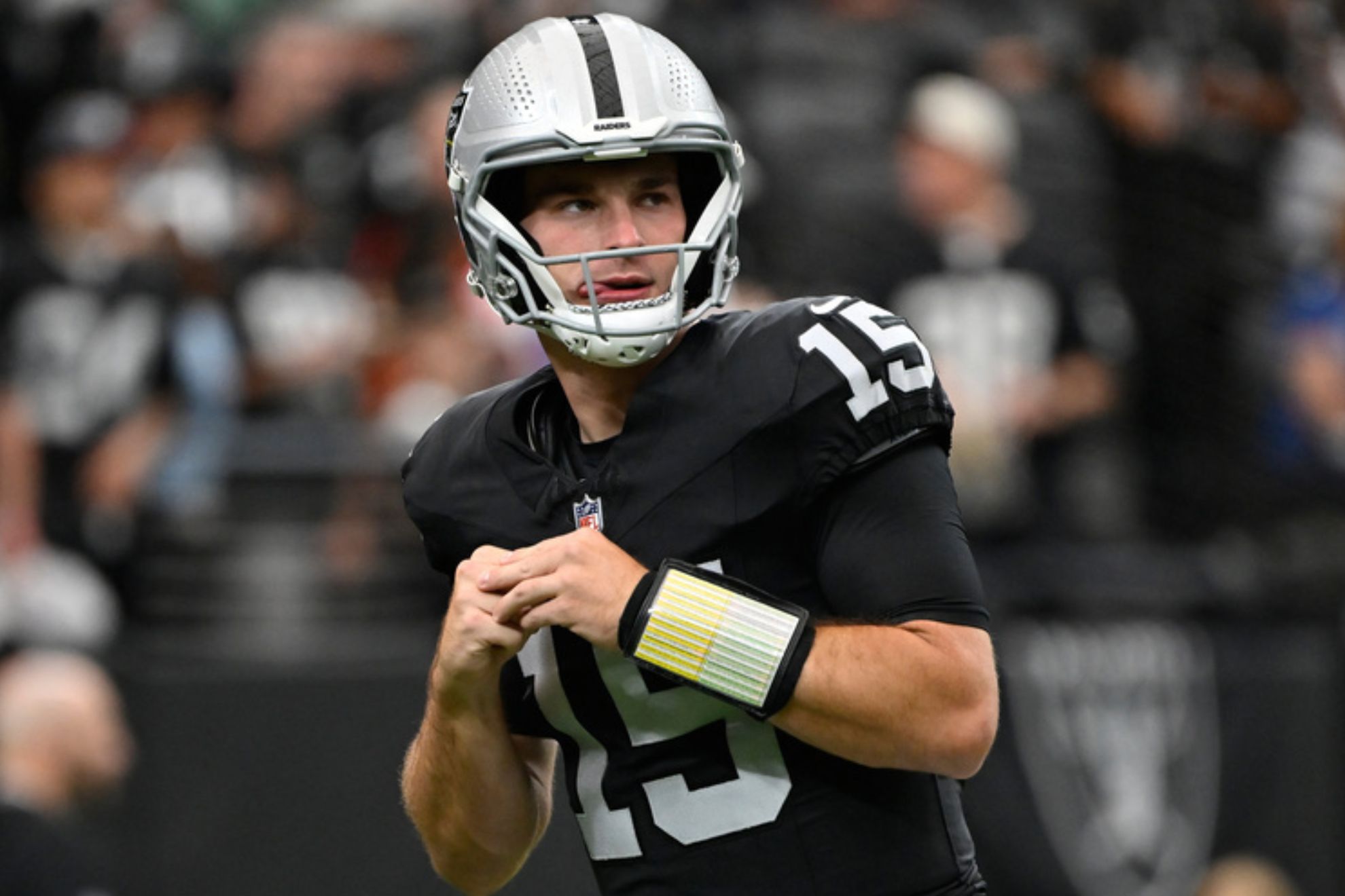 Las Vegas Raiders quarterback Fernando Mendoza (15) warms up before an NFL football game