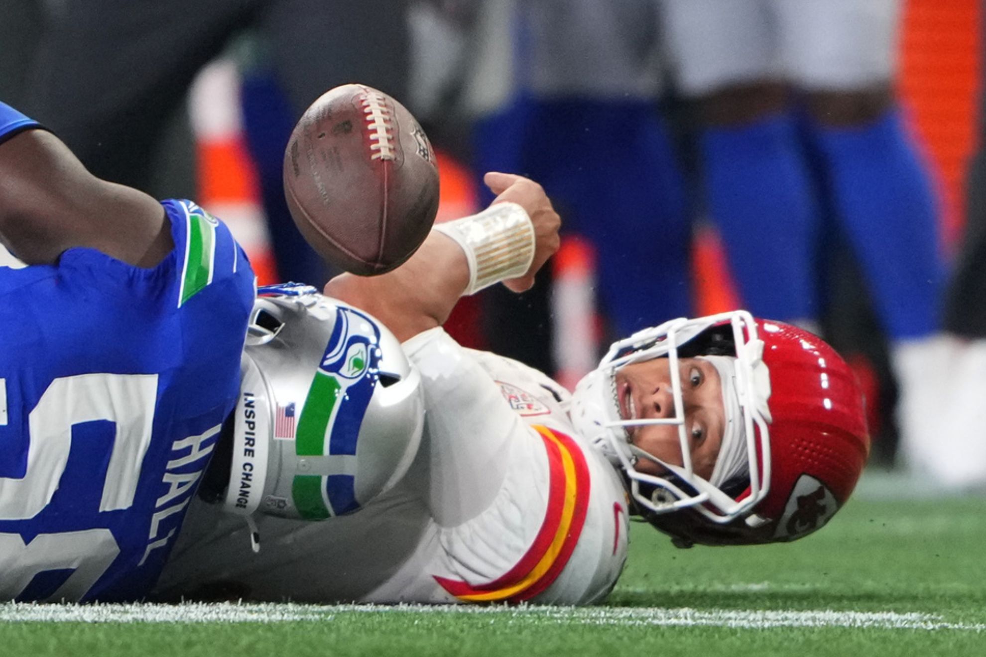 Kansas City Chiefs quarterback Patrick Mahomes loses control of the ball during the second half of an NFL football game against the Seattle Seahawks