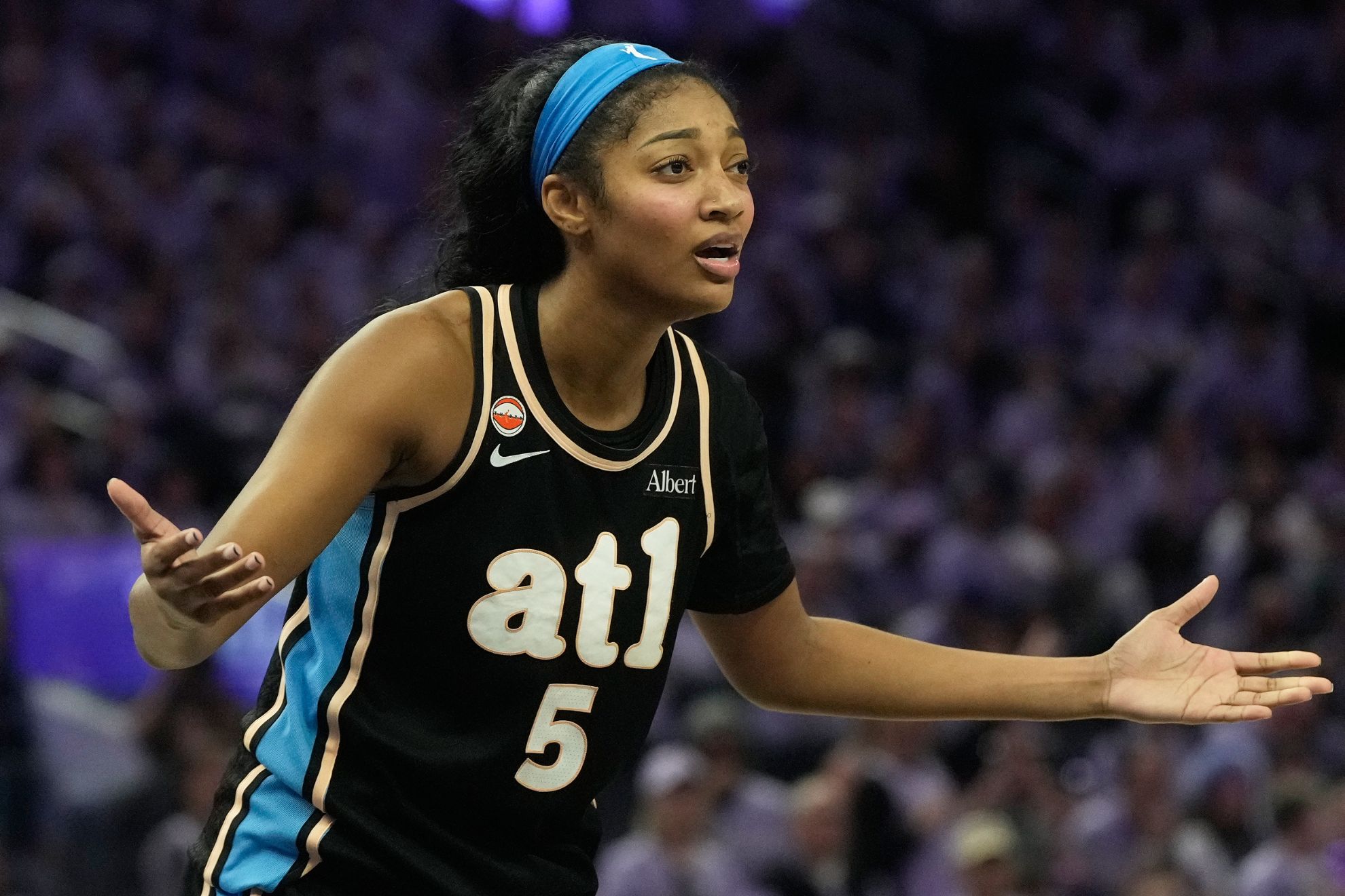 Atlanta Dream forward Angel Reese (5) reacts after being called for a foul d