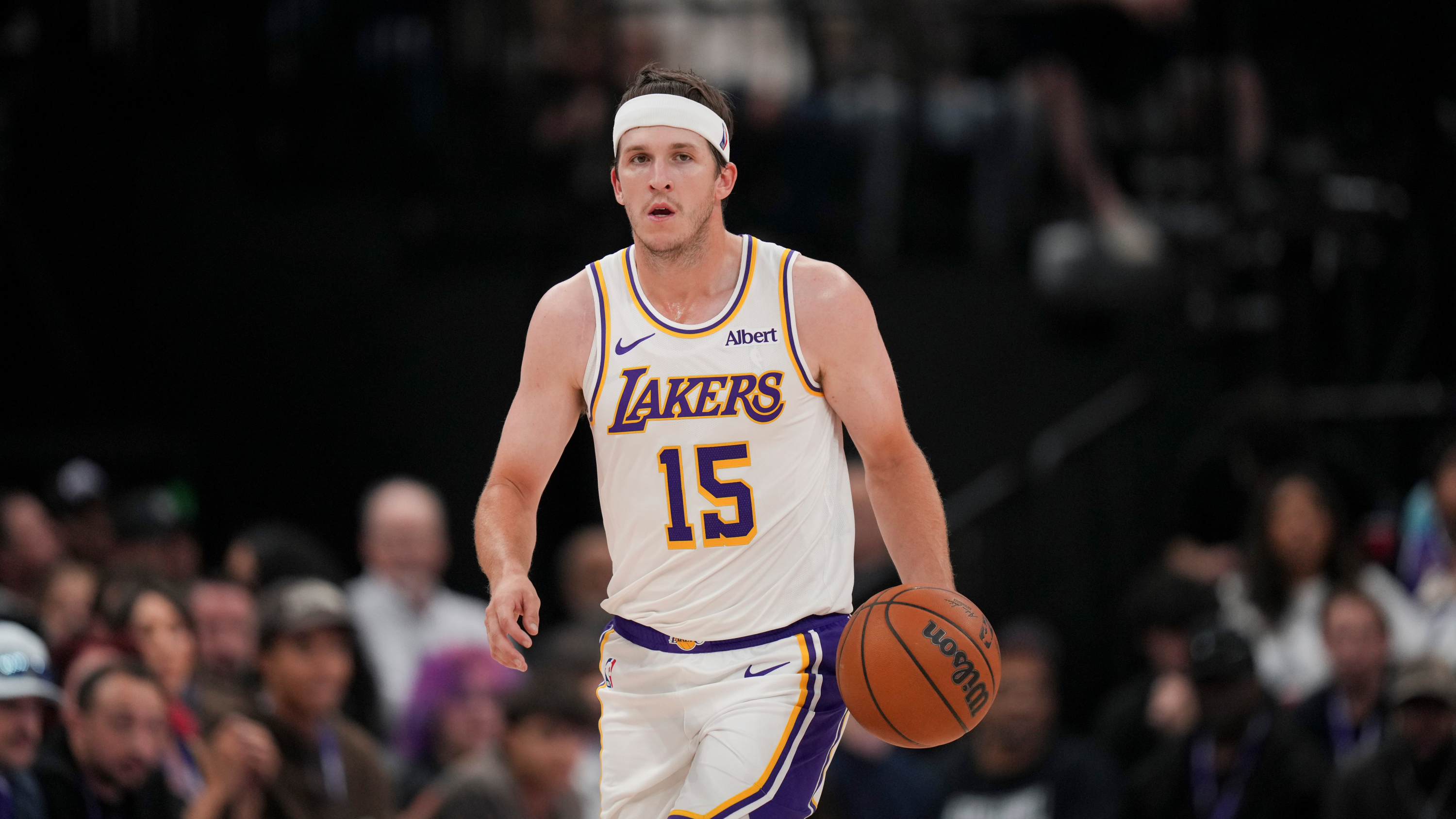 Los Angeles Lakers guard Austin Reaves (15) brings the ball down the court during the first half of an NBA basketball game against the Utah Jazz Sunday, Oct. 25, 2026, in Salt Lake City. (AP Photo/Bethany Baker) Bethany Baker