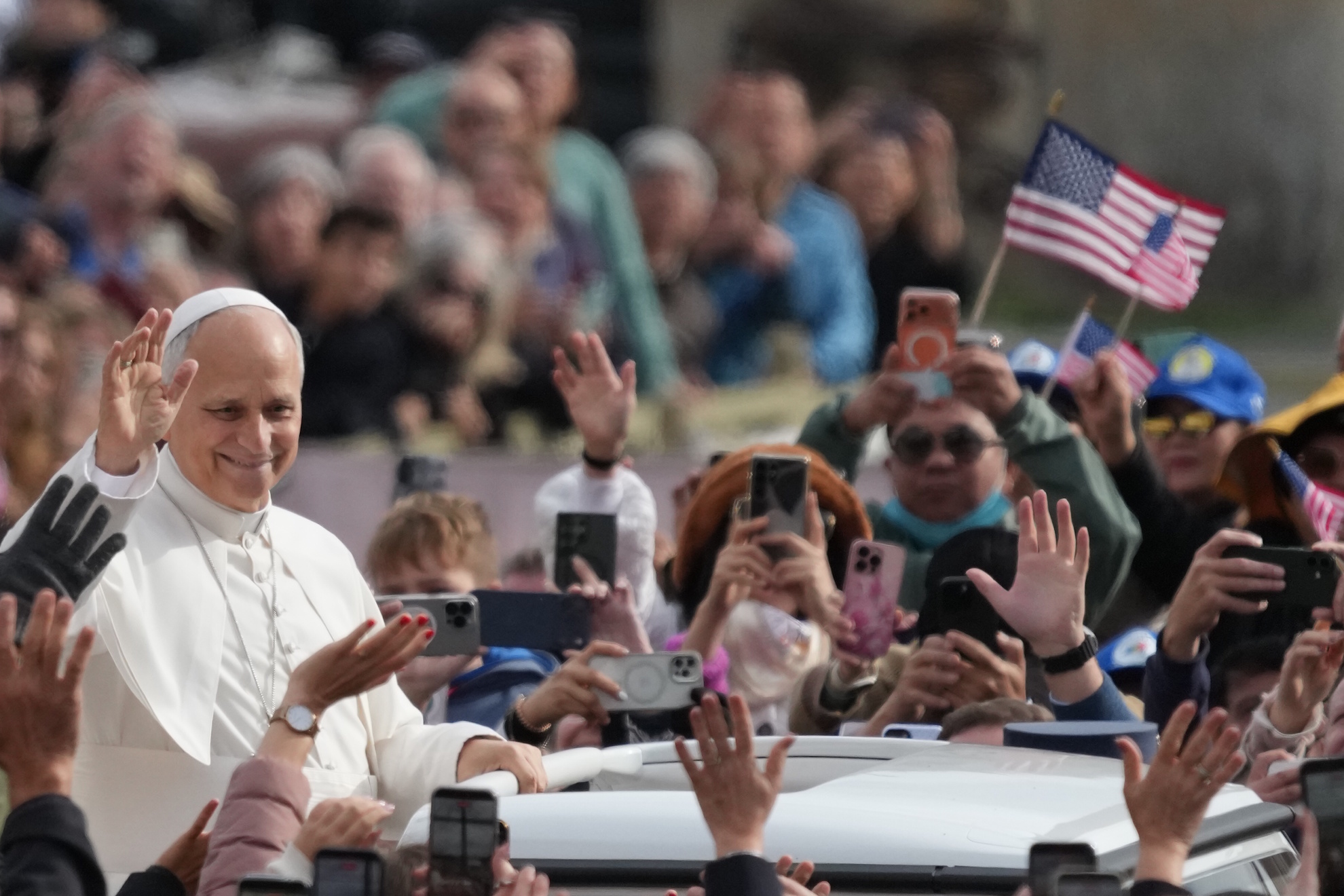 Leo XIV waves as he leaves after his weekly general audience in St. Peter's Square at The Vatican. LAPRESSE